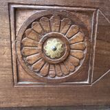 Teak chest from Burma with carved rosettes.
