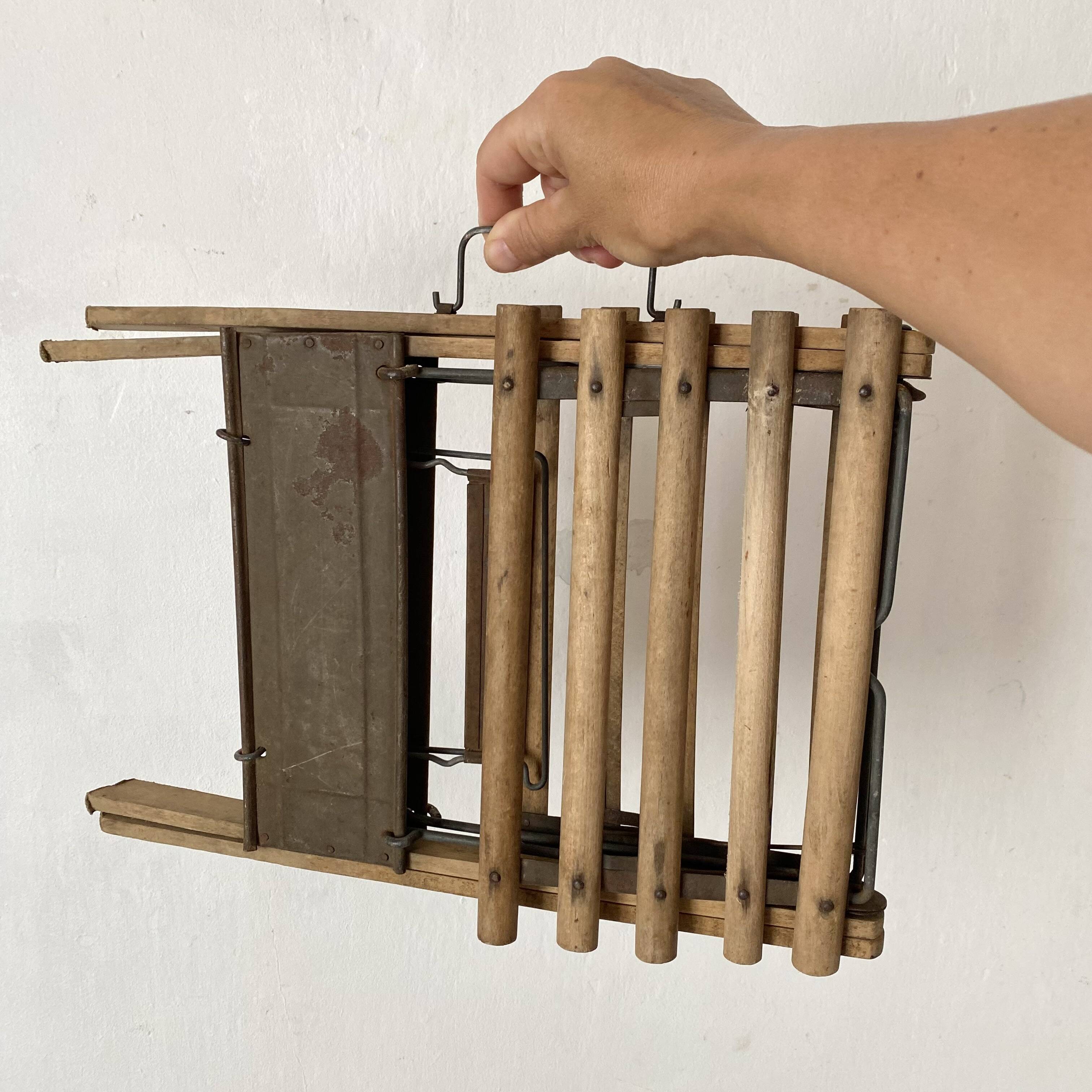 Antique folding stool with slats, plant holder