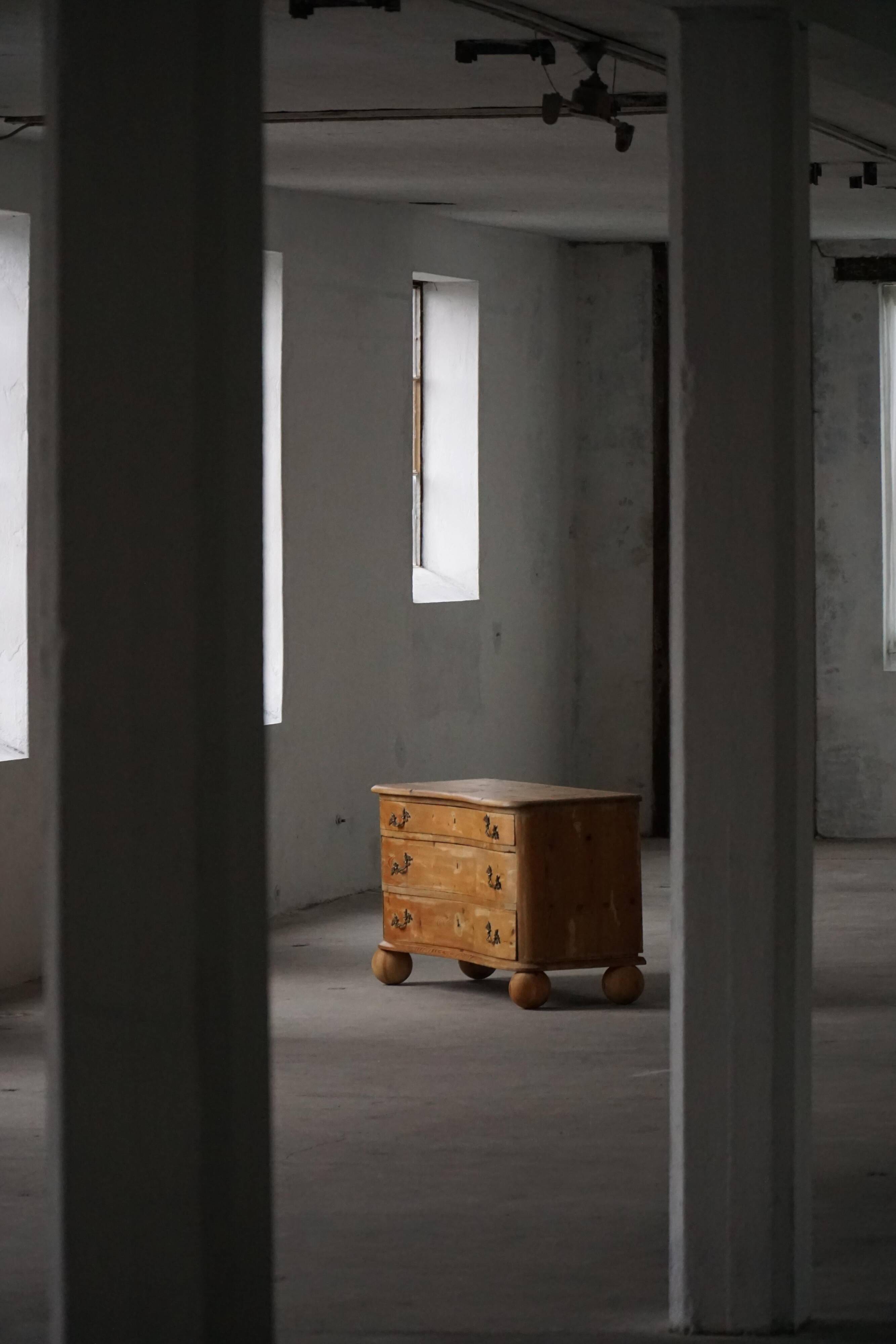 Antique Danish pine commode with ball feet, late 19th century.