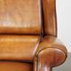 Set of 2 very comfortable large sheepskin armchairs elegantly finished with black piping