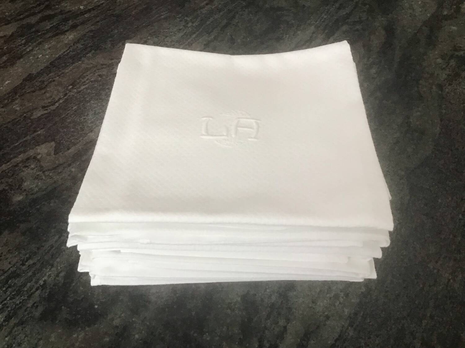 12 white damask napkins with LA monogram