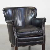 Subtle black armchair with reversible Kelim seat cushion