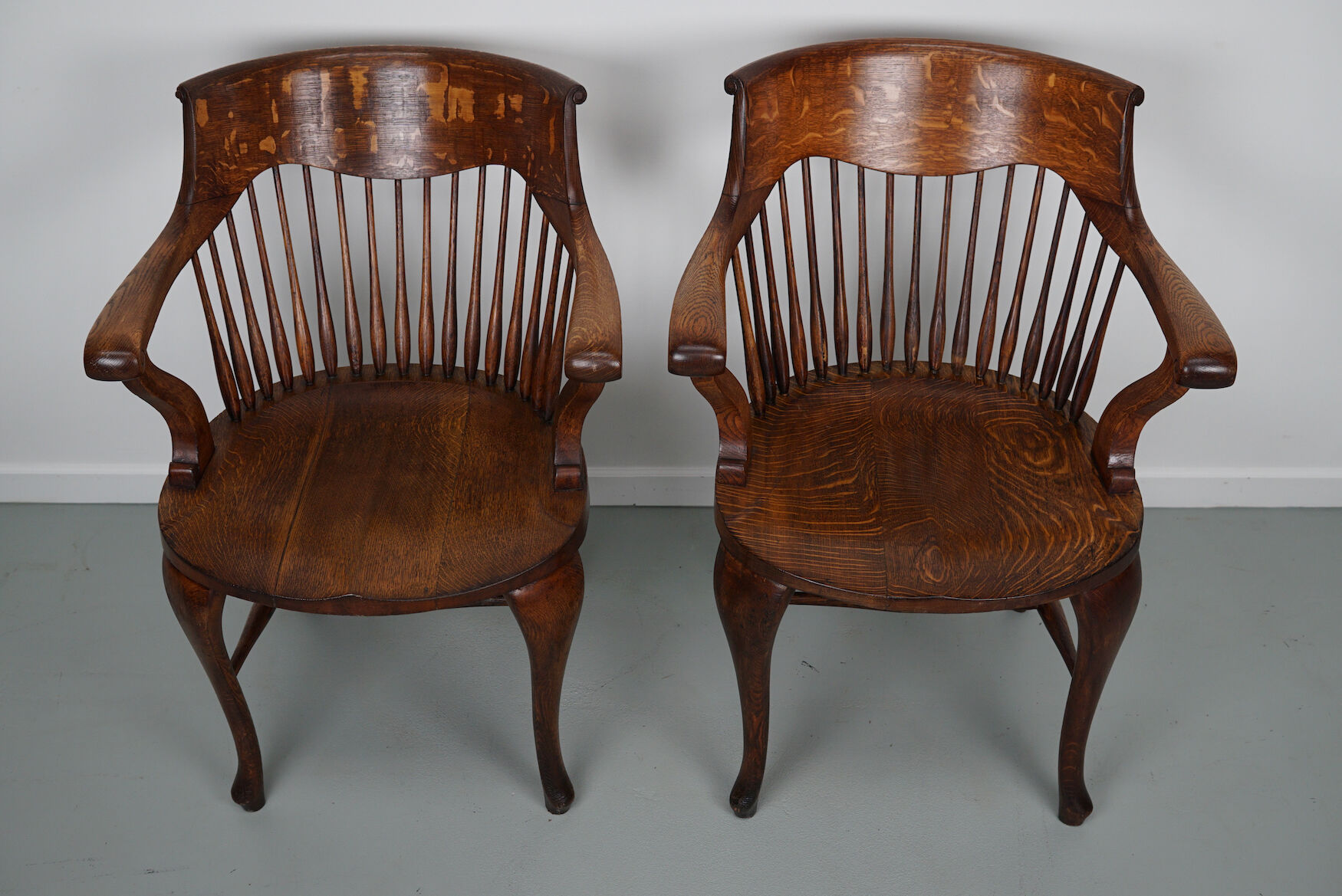 Pair of English Edwardian Oak Spindle Back Captains Office Desk Chairs