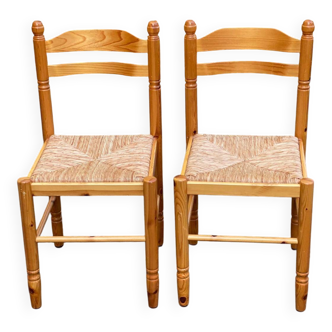 2 straw-seated chairs in light-colored solid wood