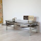 Chrome metal coffee table with smoked glass top.