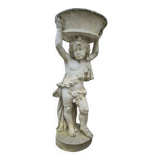 Antique reconstituted stone planter depicting a cherub