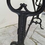 Solid oak bistro table with a cast iron base, signed.