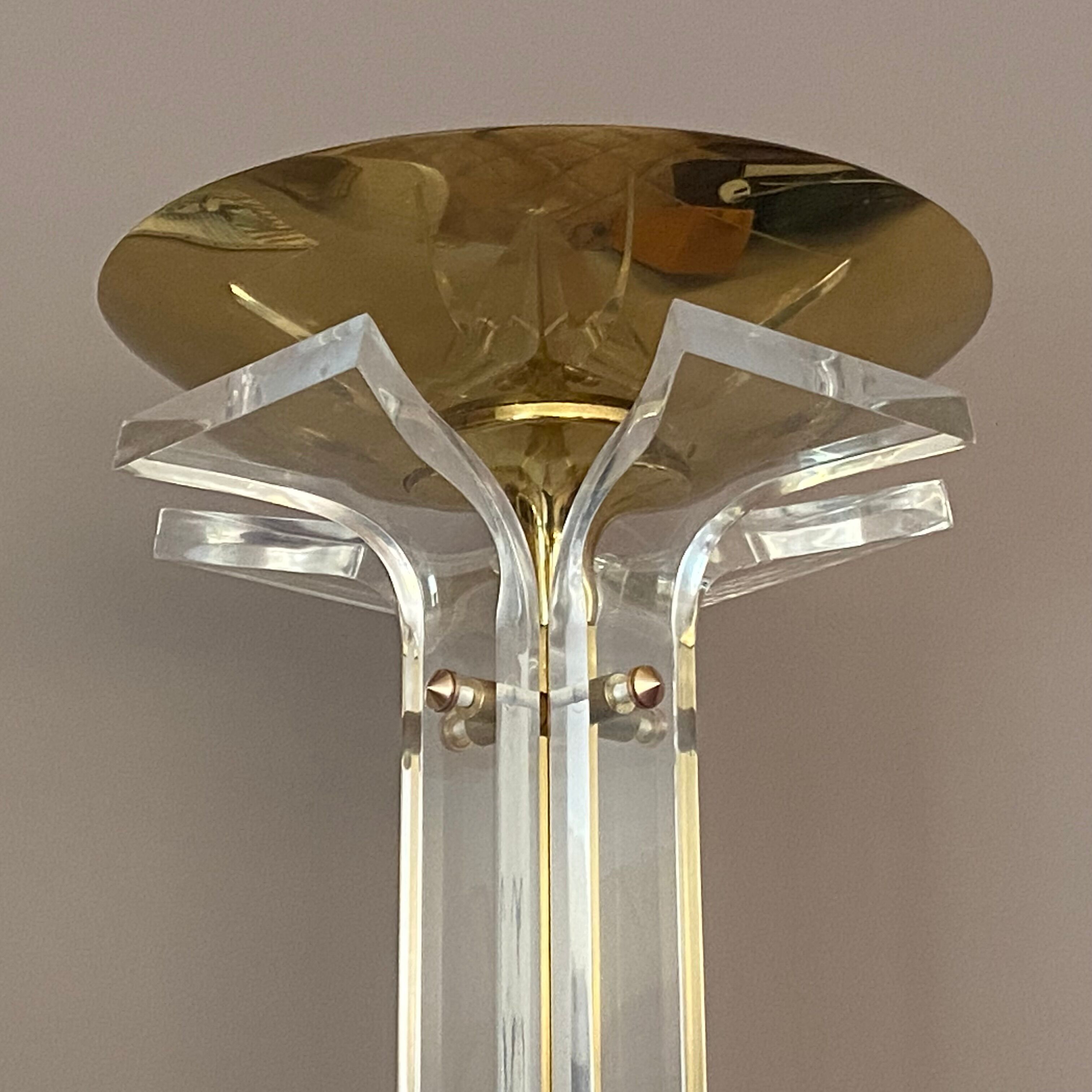 Plexiglass and brass floor lamp. 1970. Italy.