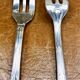 7 Christofle silver-plated oyster forks with Louis crossed ribbons