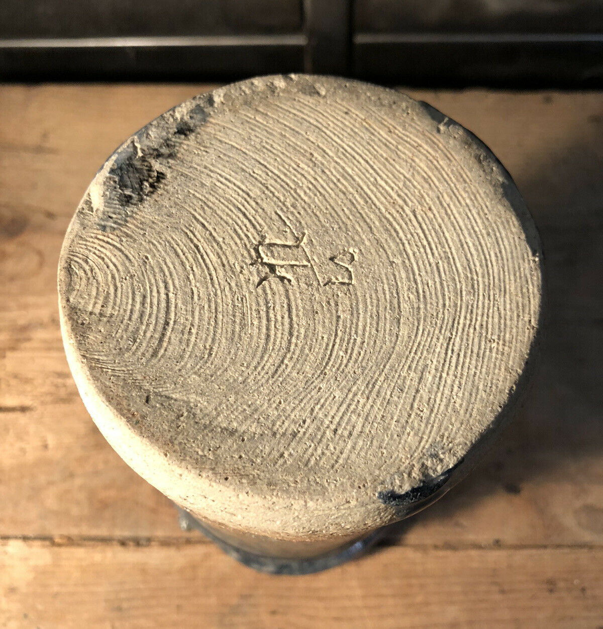 Enamelled pottery vase signed