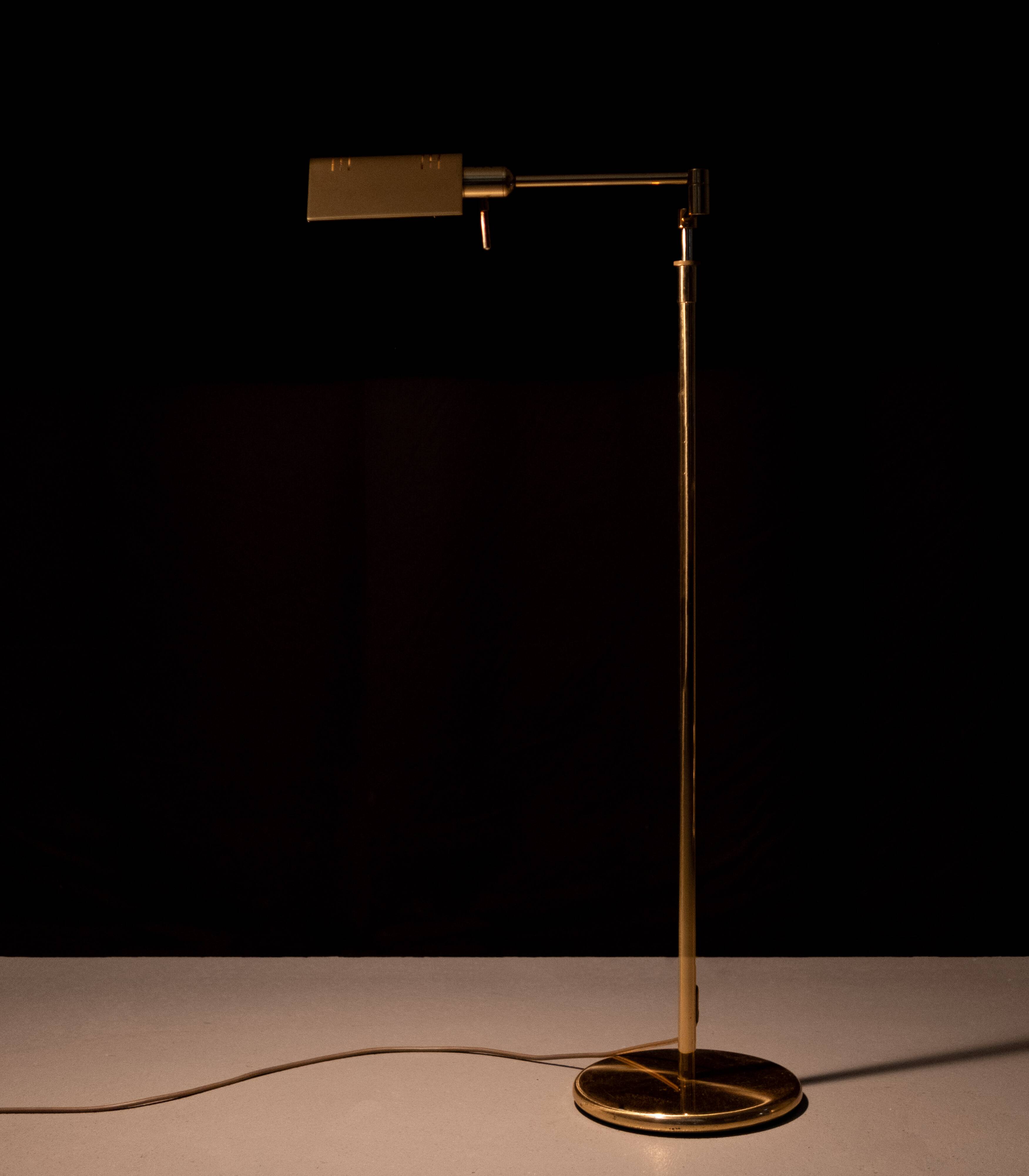 Holtkoetter adjustable Brass swing arm floor lamp. Germany