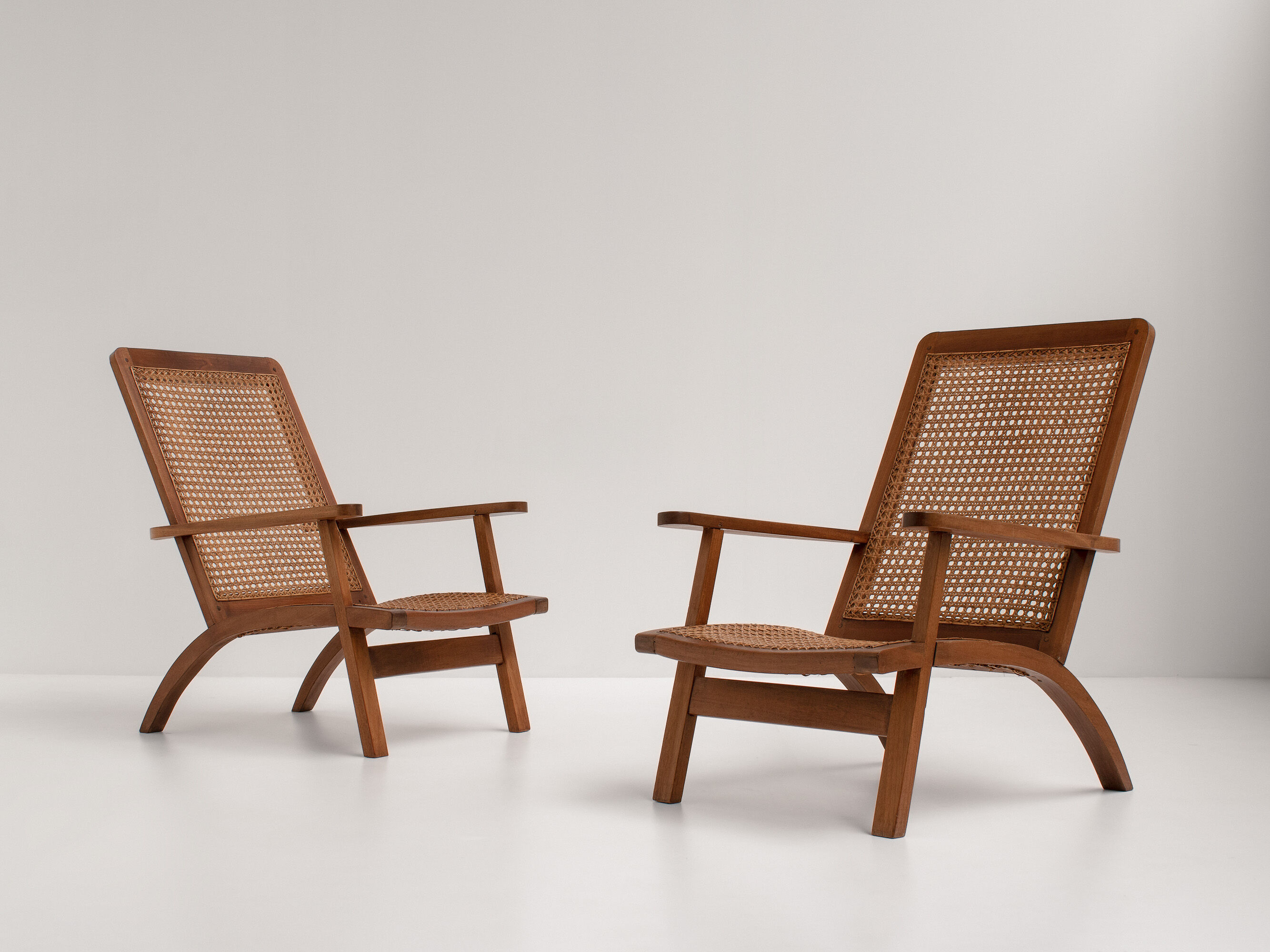 pair of french mahogany and cane armchairs, 1950s