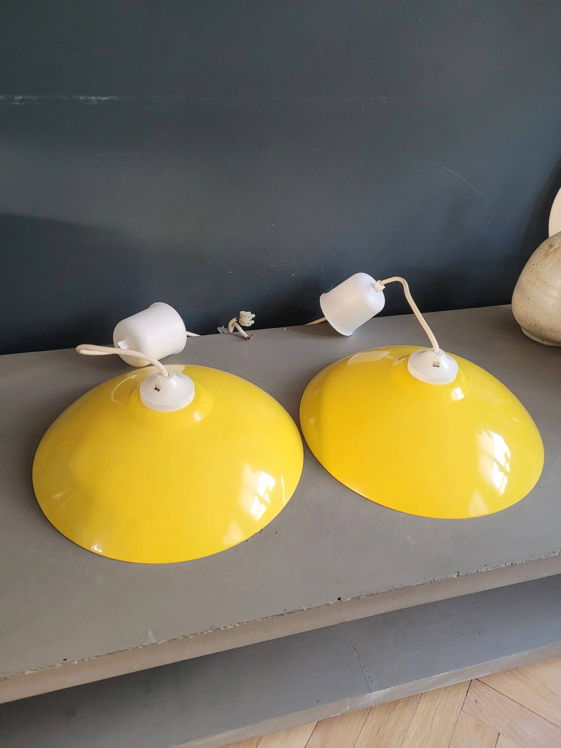 Pair of yellow lacquered metal pendant lights