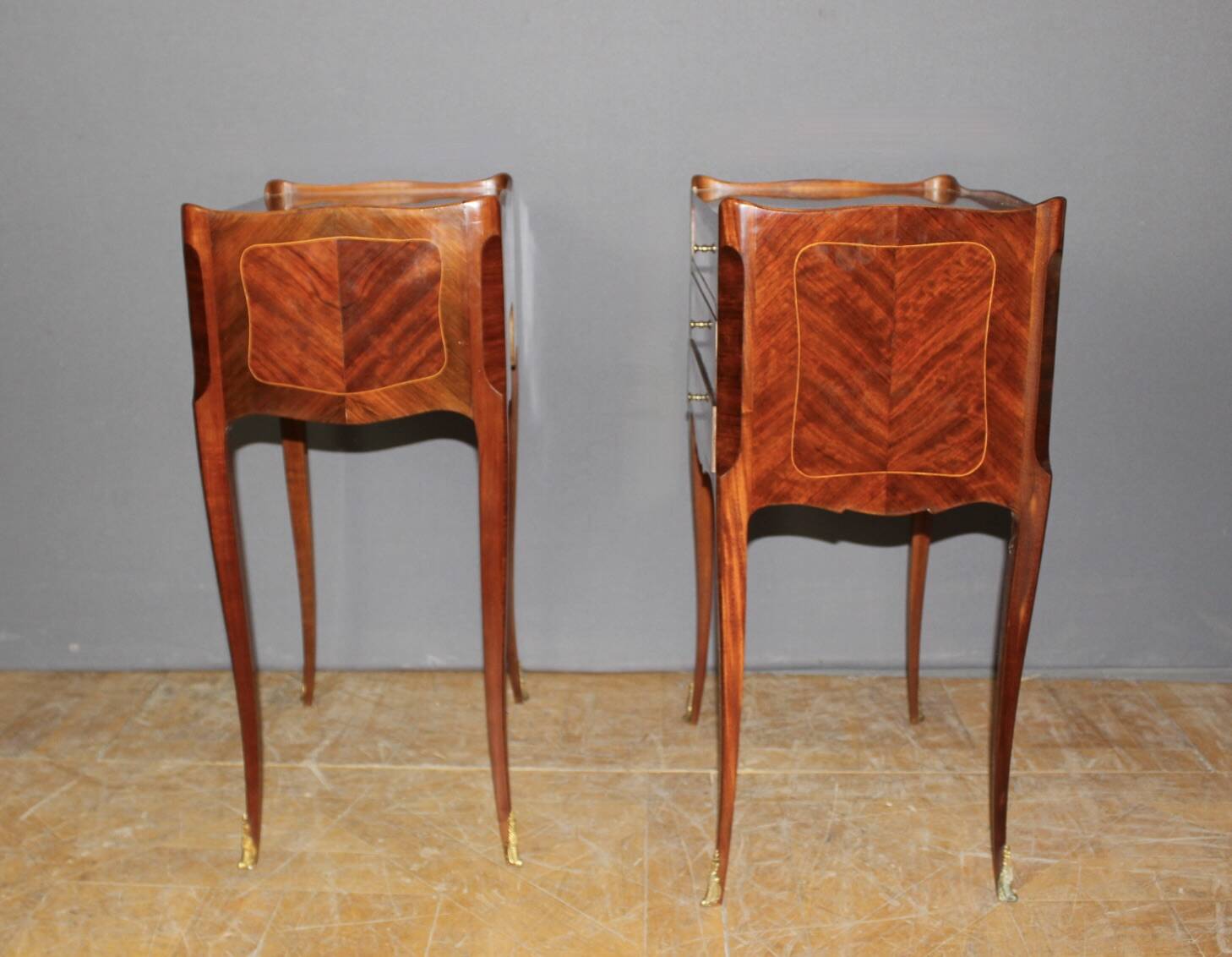 Pair of Louis XV style bedside tables in marquetry, 20th century.