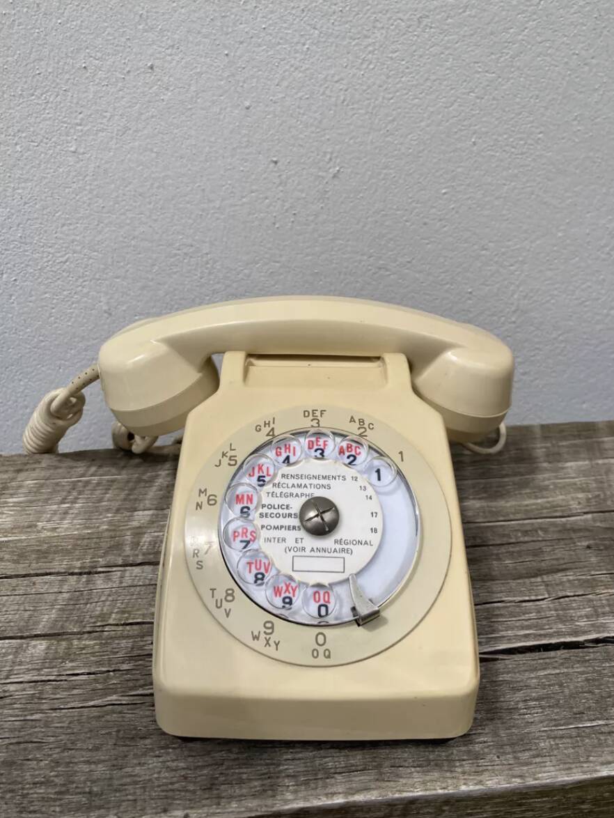 Vintage beige rotary telephone