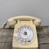 Vintage beige rotary telephone