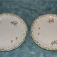Two MOUSTIER cups decorated with flowers signed