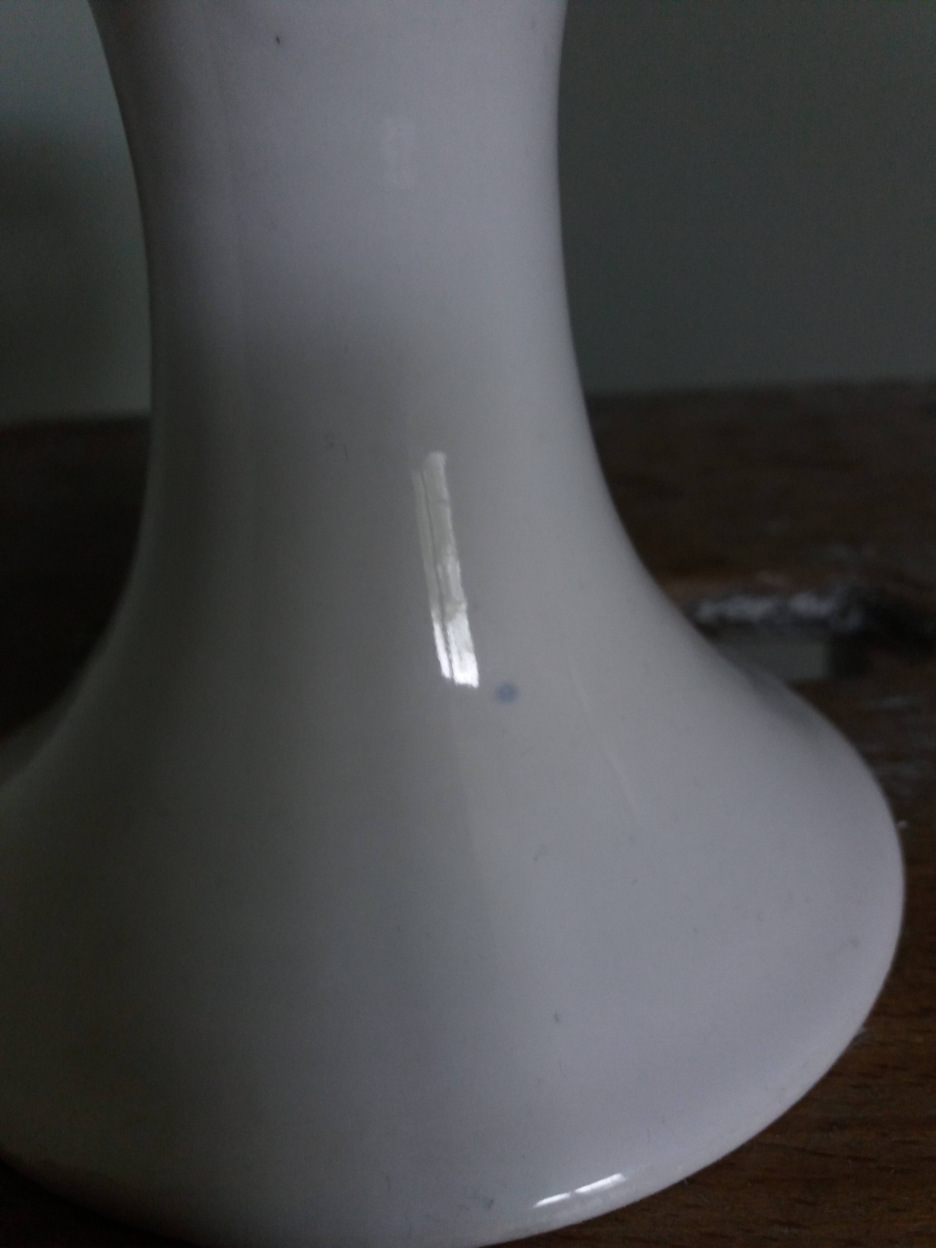 Cup on woven ceramic base with slip flowers