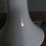 Cup on woven ceramic base with slip flowers