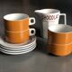 Hot chocolate cups and milk jar