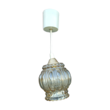 Suspension in molded glass golden reflection