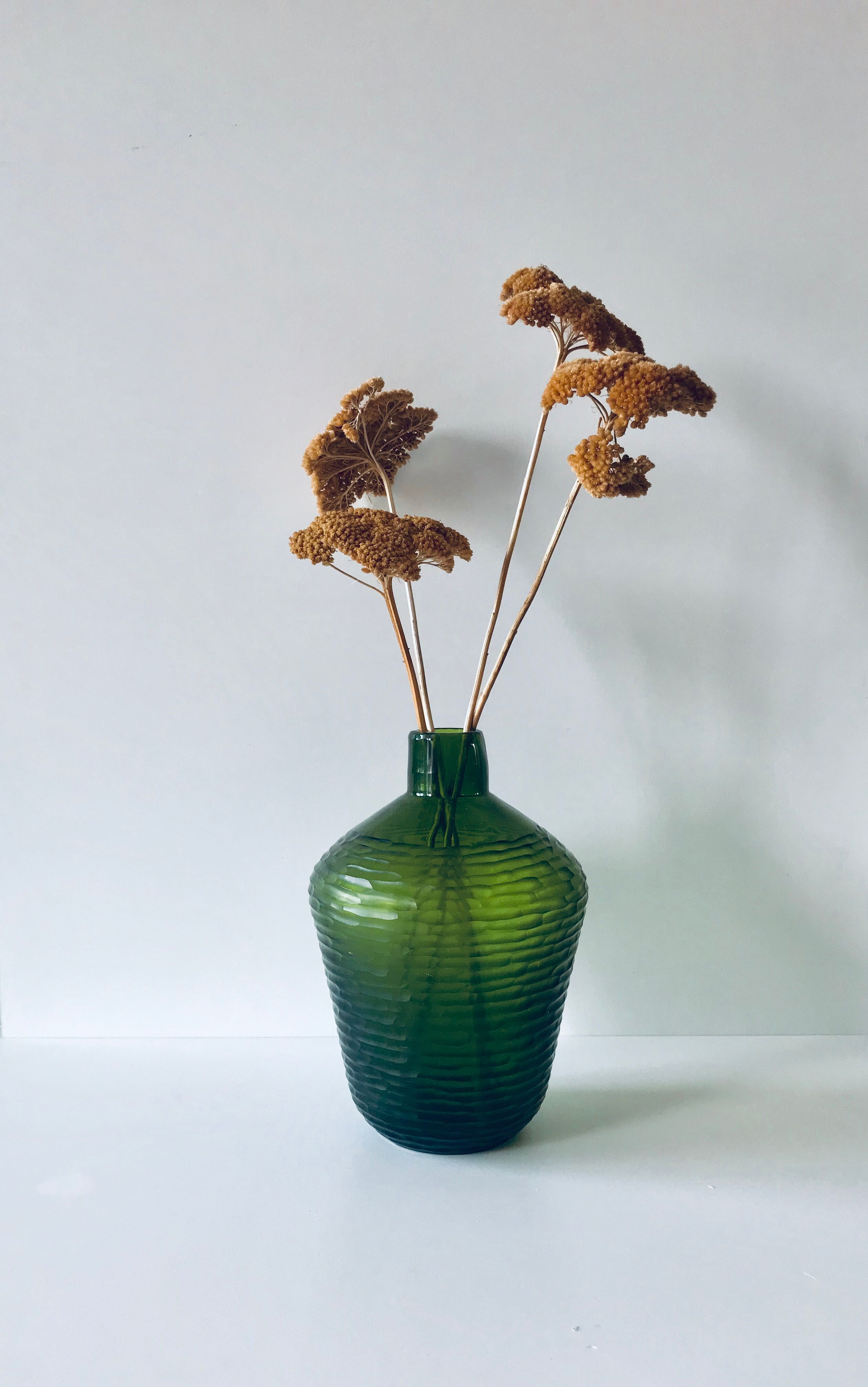 Green carved glass vase