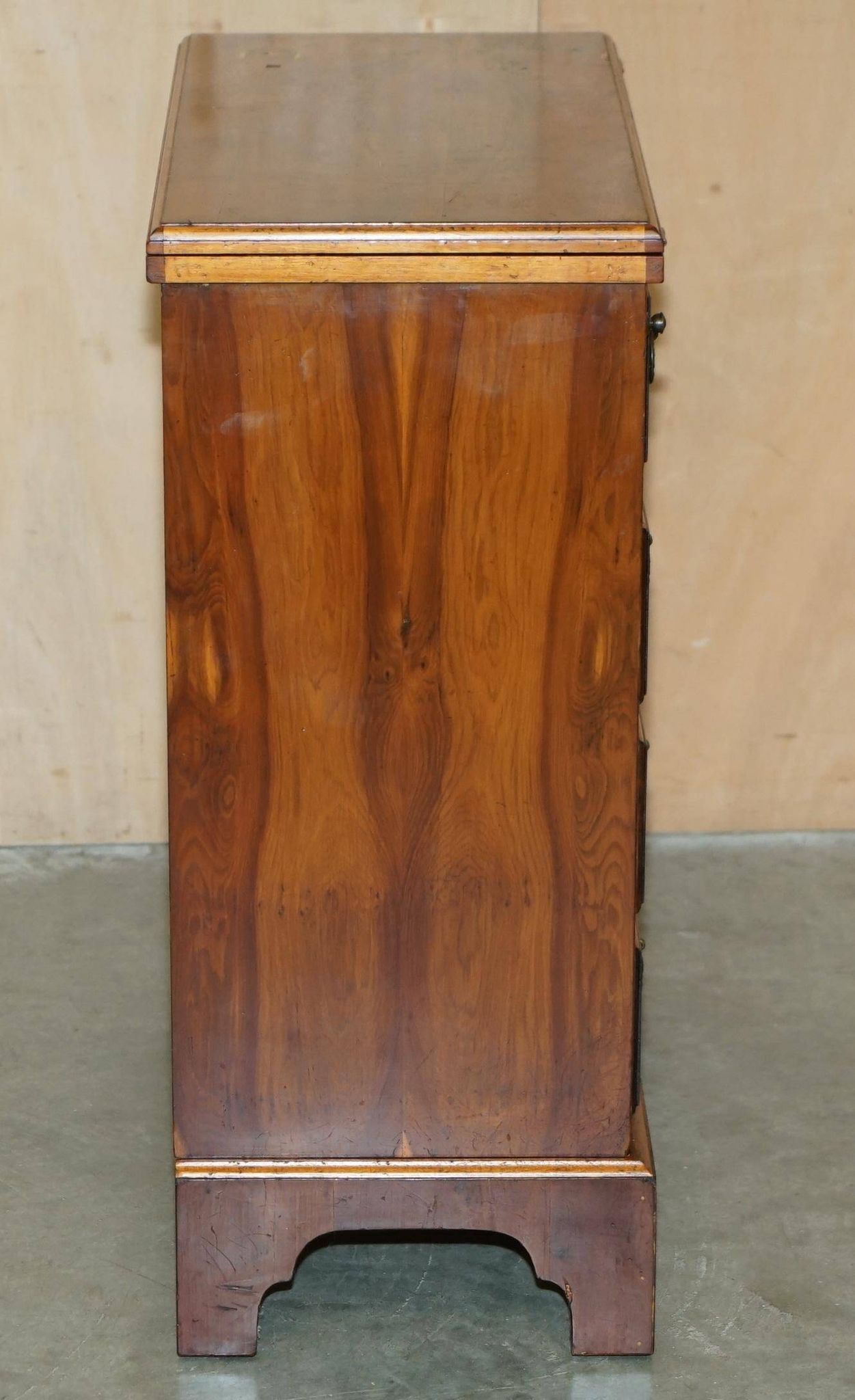 Vintage walnut commode with sliding top in Butler style.