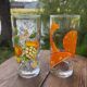 Vintage set of 4 fruit-decorated orangeade glasses.