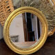 Miroir rond en bois de couleur dorée