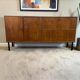 Vintage wooden sideboard with black steel legs.