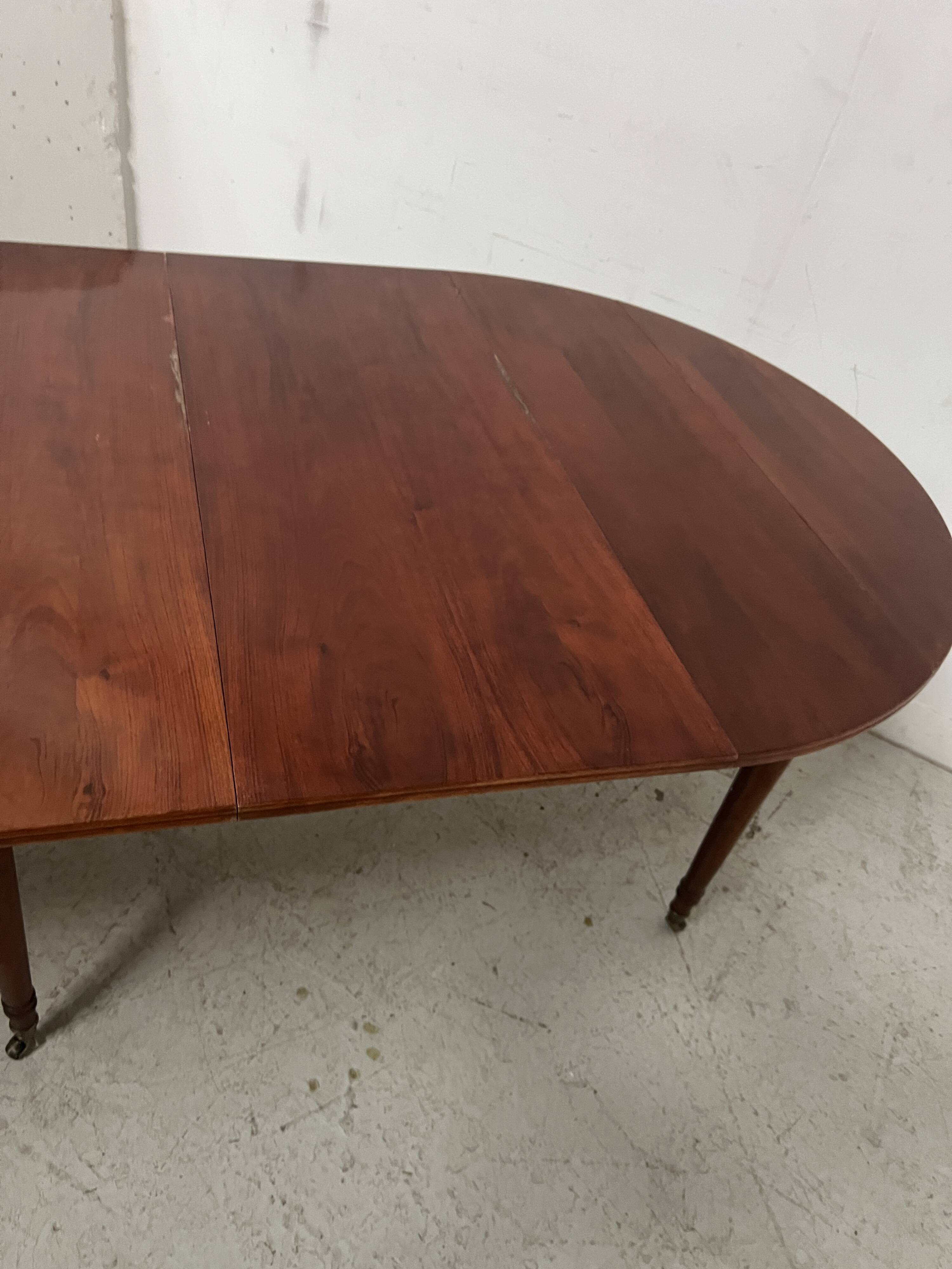 A six-foot Louis XVI style mahogany table from the 19th century.