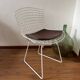 White Wire Chair design by Harry Bertoia with leather cushion.