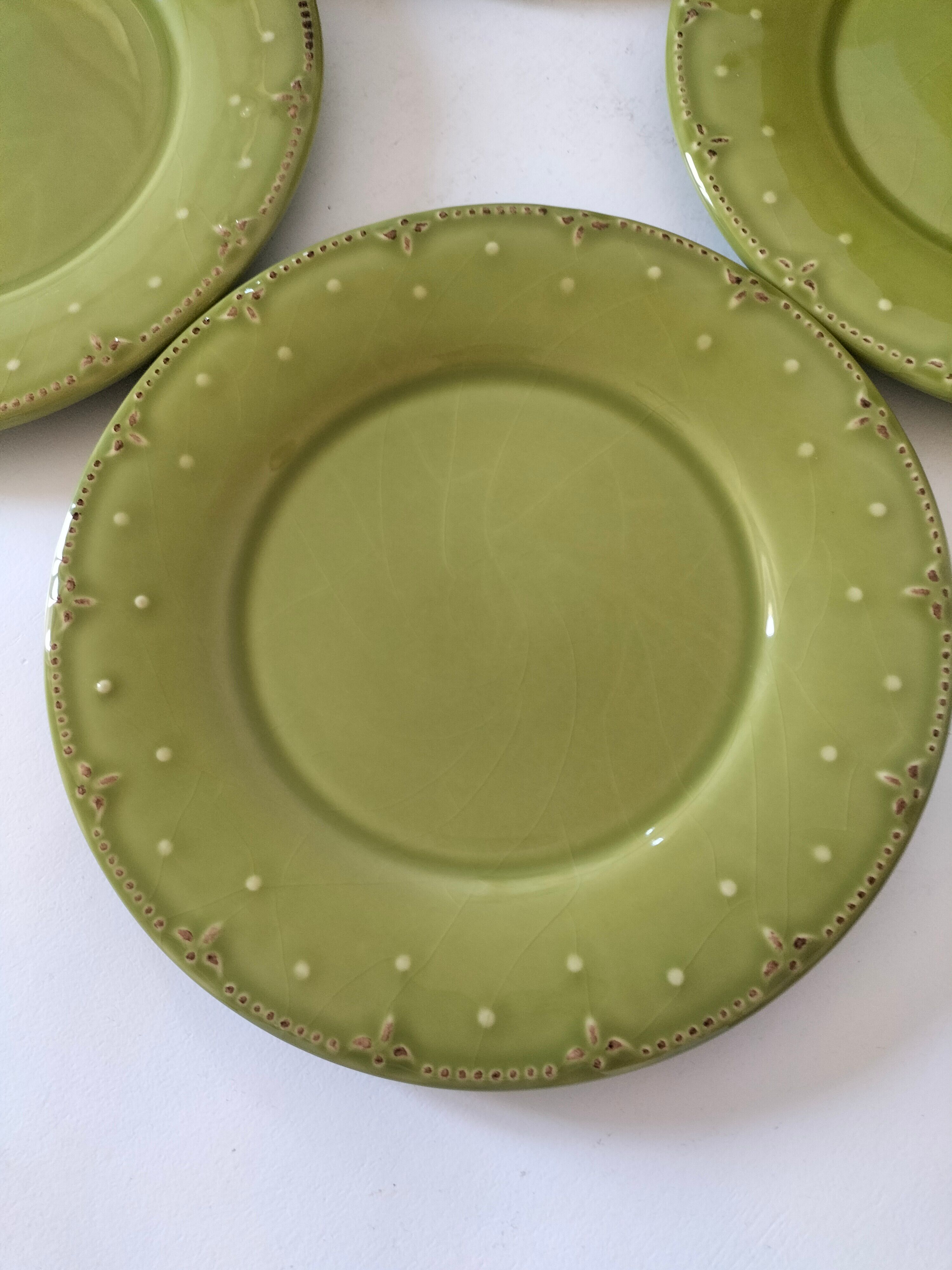 6 olive green plates with dotted relief, workshop ceramic style