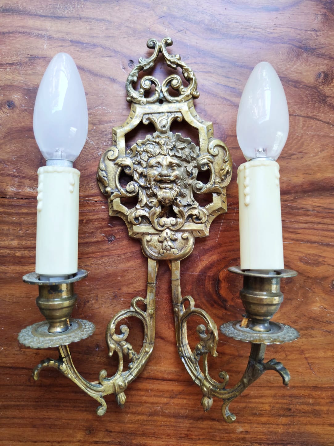 Pair of gilded bronze sconces decorated with Louis XIV style mascarons