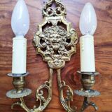 Pair of gilded bronze sconces decorated with Louis XIV style mascarons