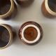 Service of 6 coffee cups in handcrafted glazed ceramic, amber brown, 1970.