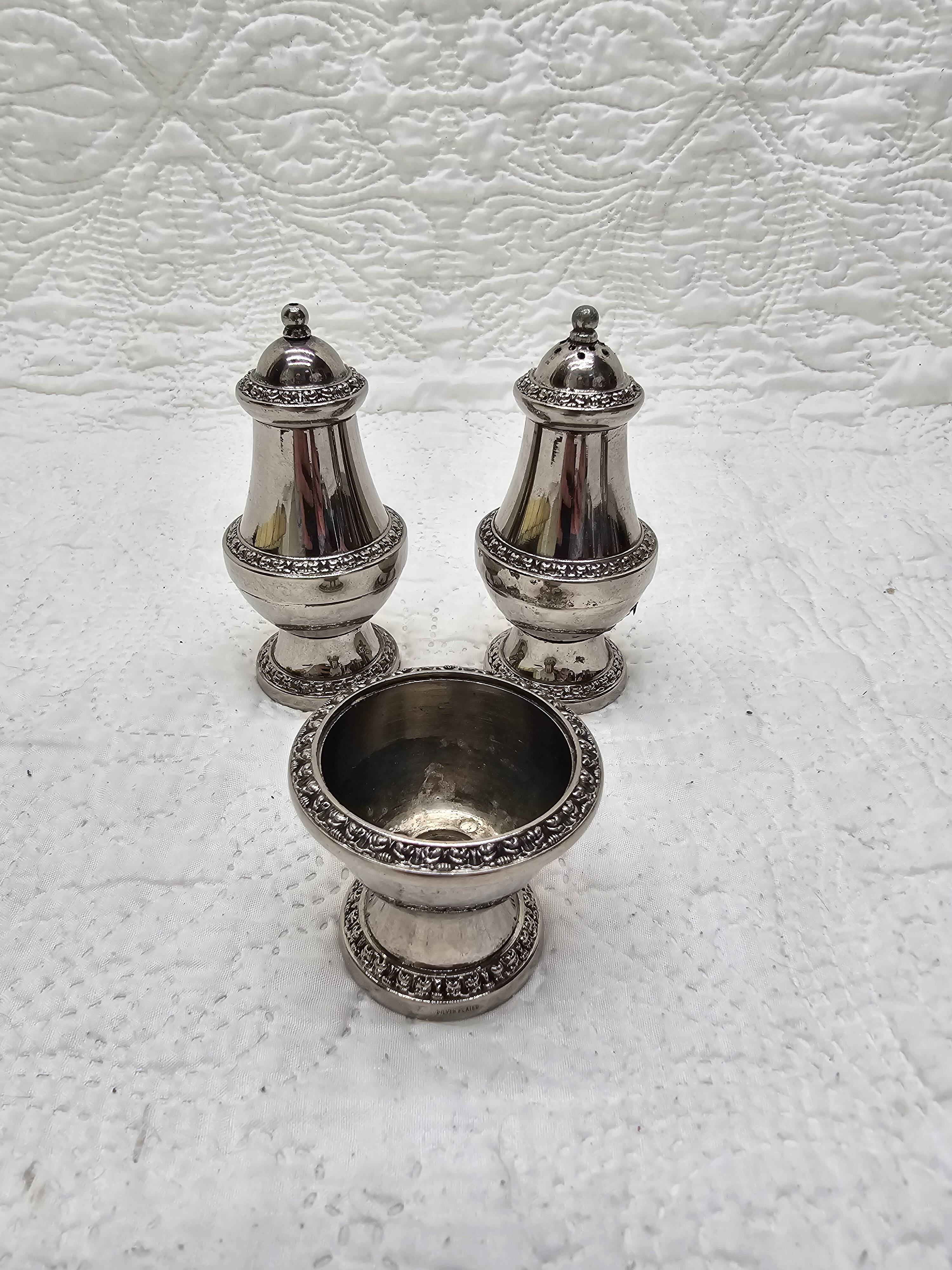 Silver-plated salt and pepper shakers and egg cups