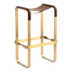 Bar stool in aged brass and brown leather.