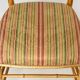 Pair of golden wood chairs in a bamboo style.