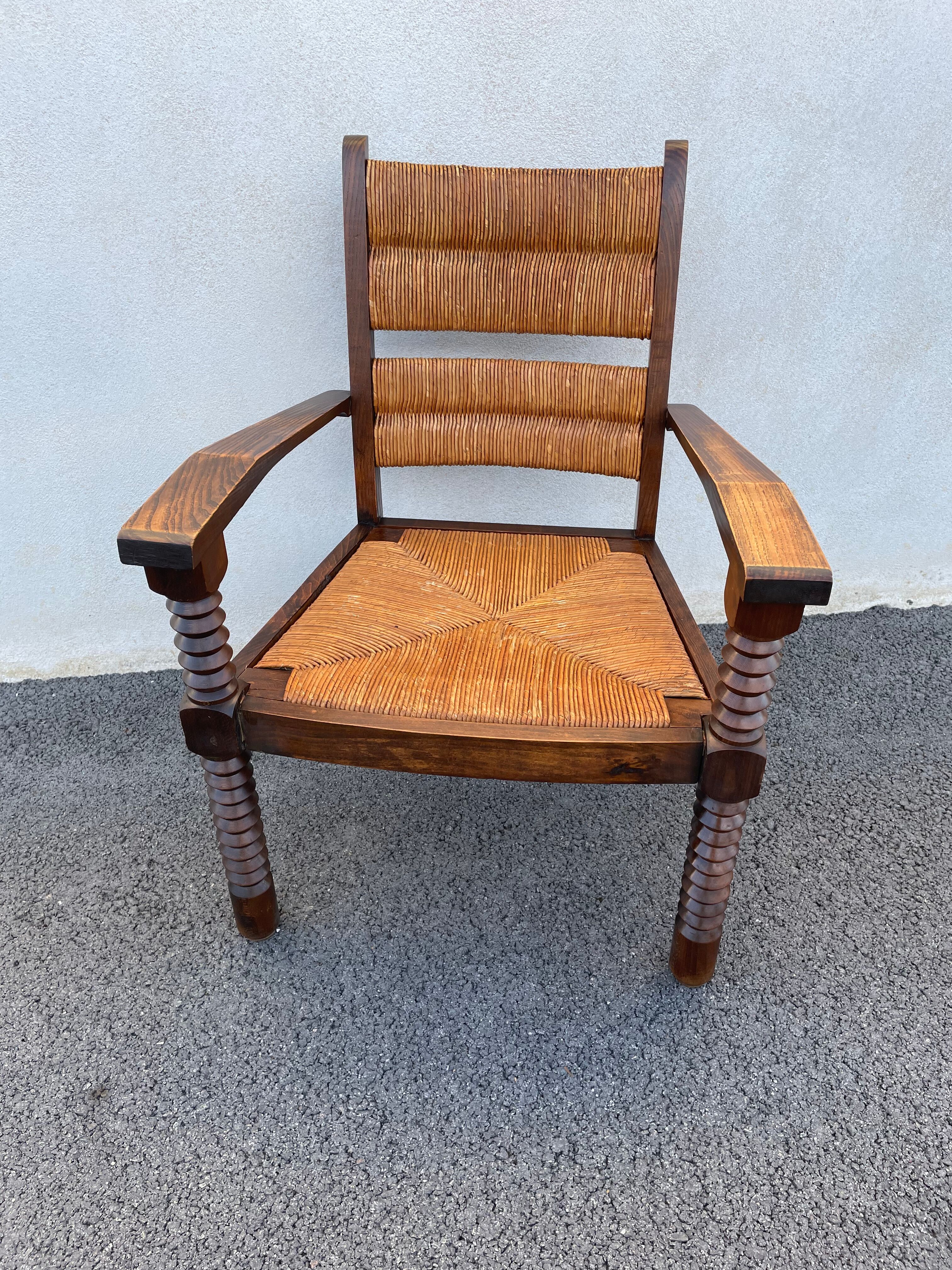 Vintage armchair in straw and brutalist wood