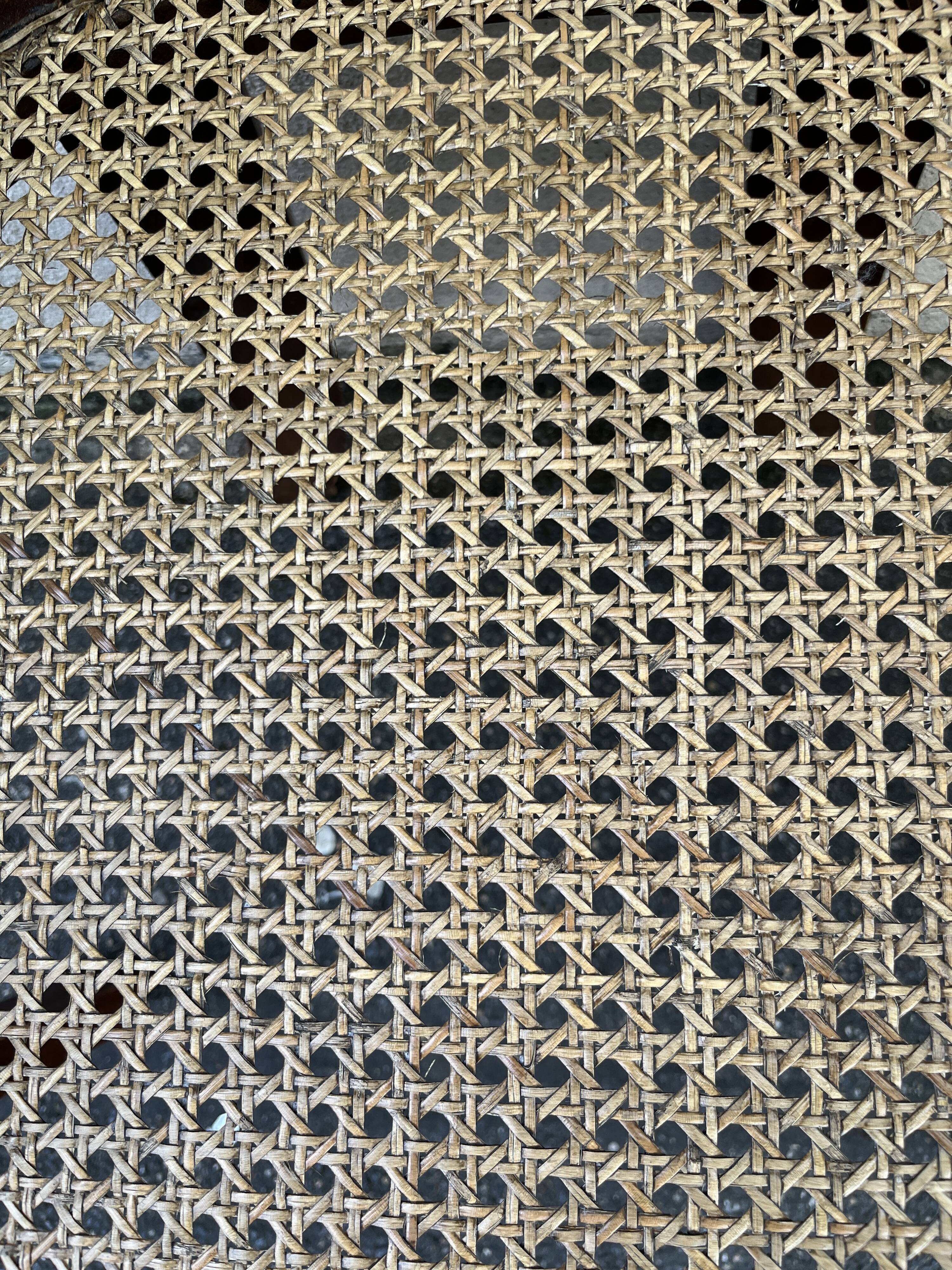 Large caned armchair