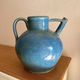 Old oriole in speckled blue glazed stoneware, south-west.