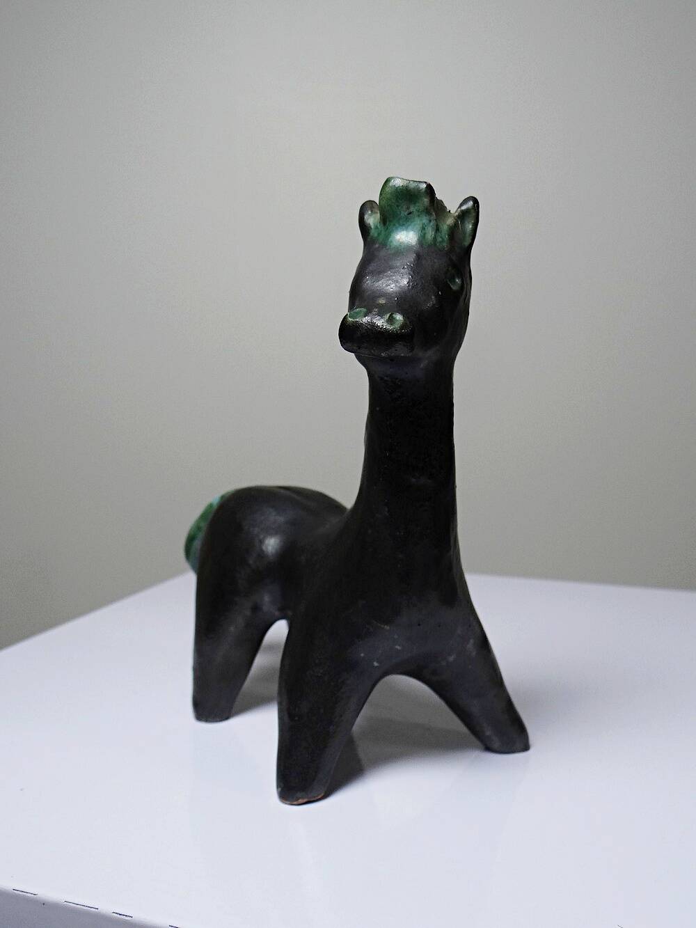 Stylised vintage horse in black and green glazed clay, handcrafted.