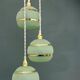 Suspension triple vintage glass globes in frosted green and gold.