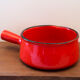 Vintage poelon in bright red glazed ceramic