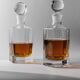 Lot of vintage 1970s consisting of 2 hexagonal glass carafes, transparent glass with spherical stoppers.