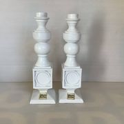 Pair of white resin candle holders