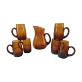 Ensemble composé d’un pichet et de 6 verres ambrés années 70