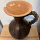 Scarified ceramic vase with twisted handle - African style