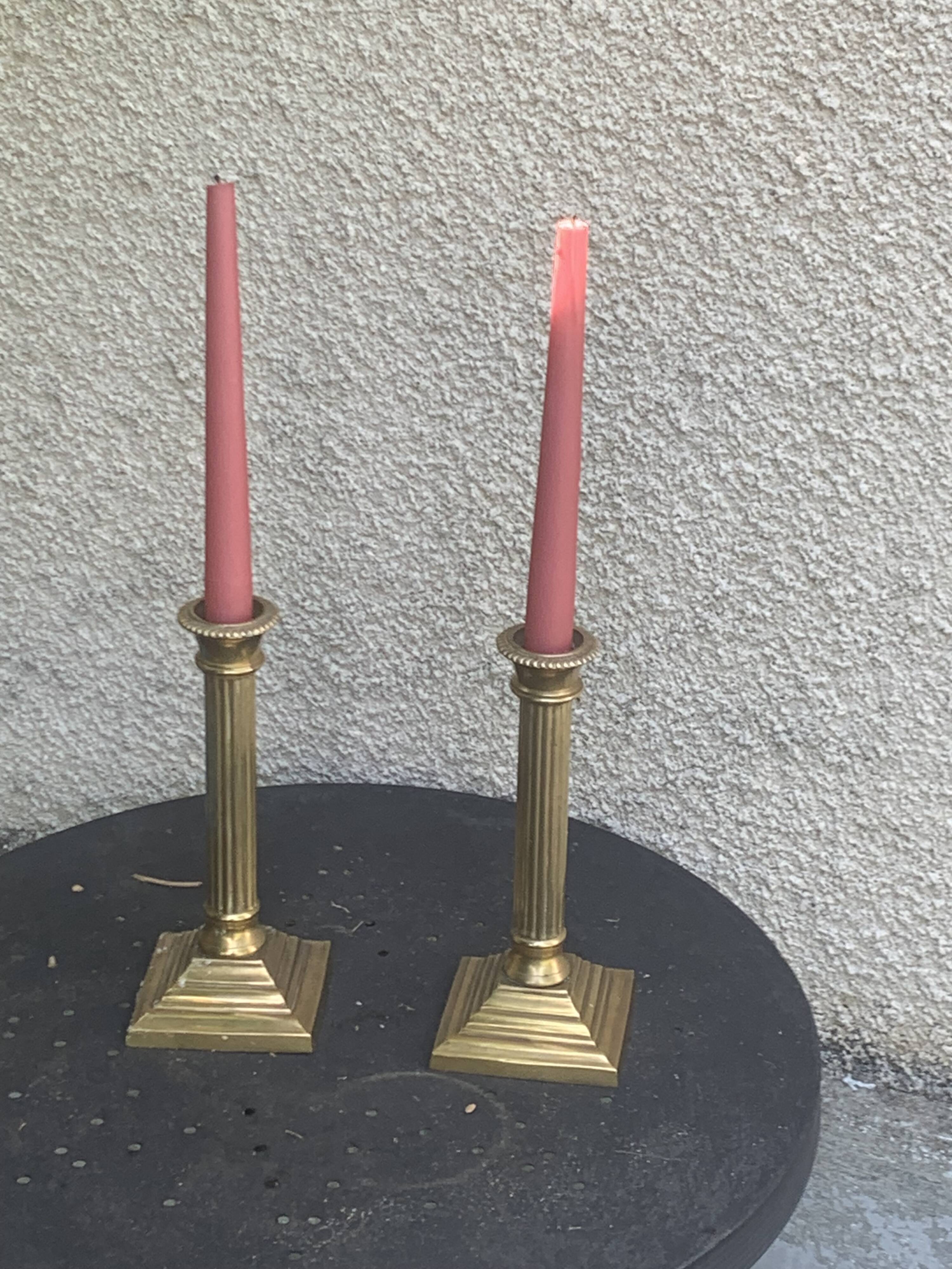 Pair of gilded brass candlesticks, vintage column shape